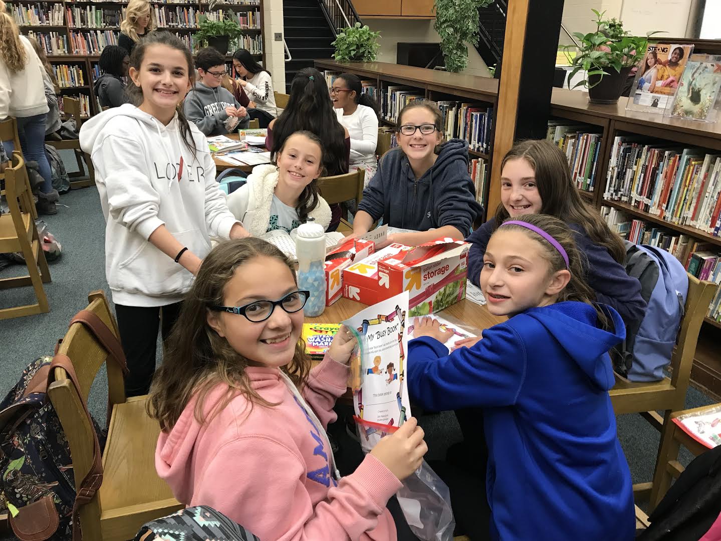 Islip Middle Schoolers get ‘busy’ with book donations | Team Up 4 Community